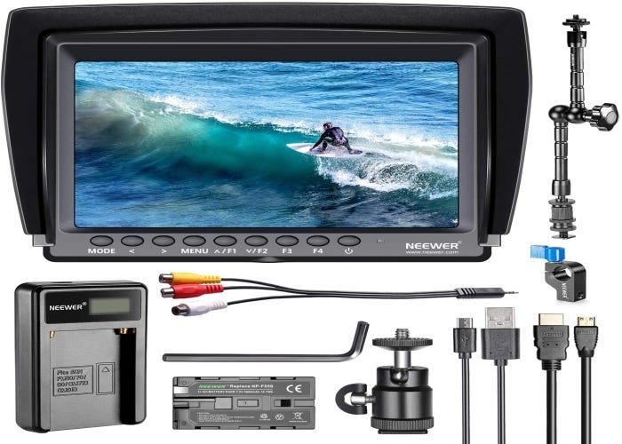 FPV monitor showing someone surfing and surrounded by assorted accessories