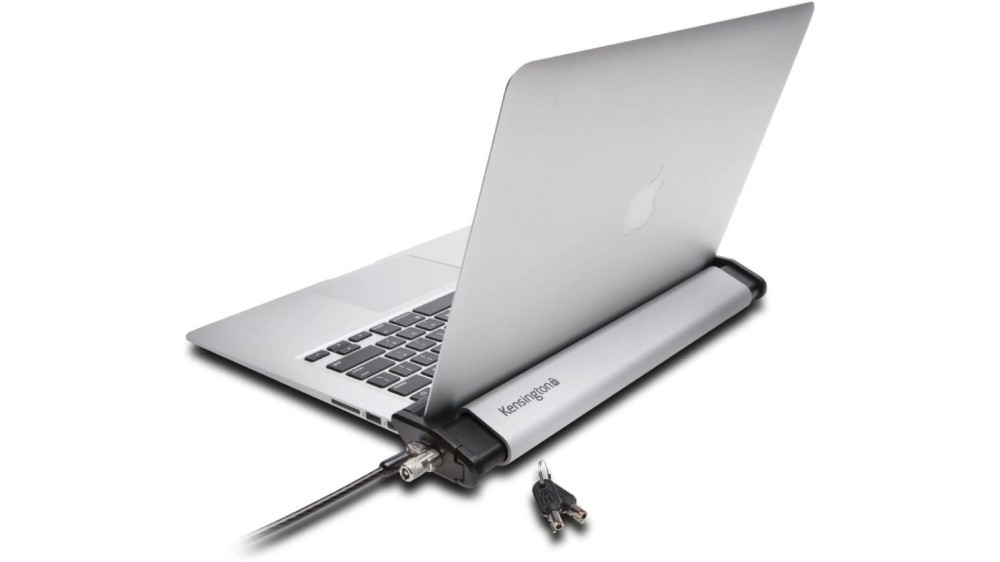 A Mac laptop with a wrap-around system attached to a black cable.