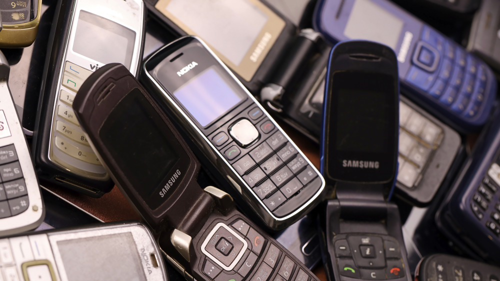 A pile of old feature phones.