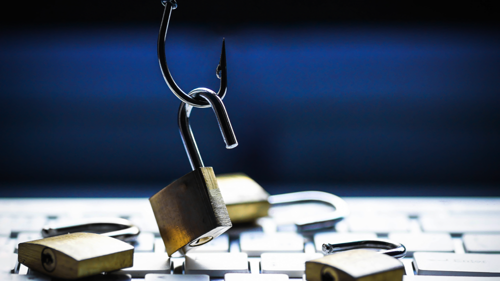 A fish hook taking away a padlock.